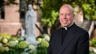 Father Colin Kay on campus. 