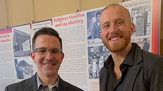 Photo of Professor Thomas Rzeznik and Bill Kuncken at the That 70s Catholicism exhibit at the American Catholic Historical Society in Philadelphia.