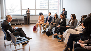 Ambassador Kőrösi pictured speaking in front of a group of diplomacy students in a candid Q&amp;A.