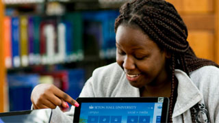 Female student looking at a computer