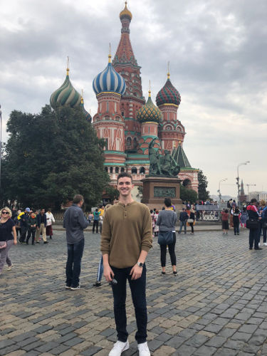 Fulbright scholar Aiden Miller in Moscow, standing in front of the Cathedral of the Vasily Blessed or better known as Saint Basil’s Cathedral.