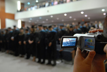 A video camera capturing the graduation of Seton Hall's School of Diplomacy's first class of graduating students.
