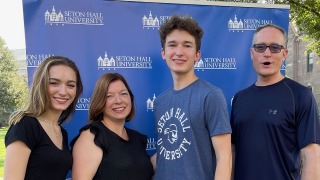 Image of the Hajek Family in front of Seton Hall's campus. 