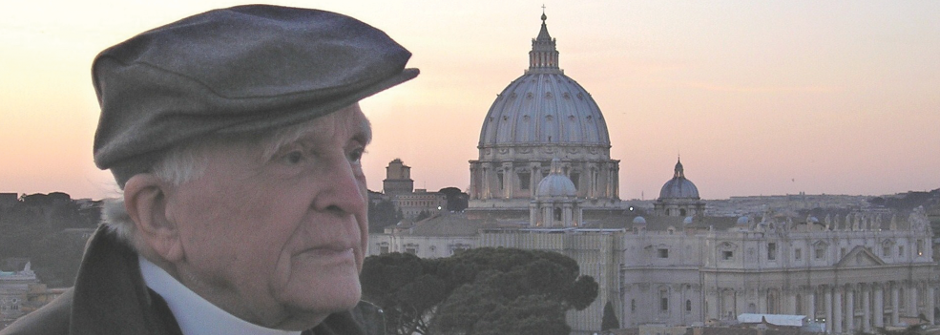 Fr. Jaki looking over a European city at sunset.