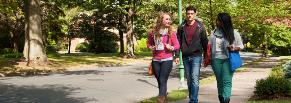 Students walking in a neighborhood off-campus. 