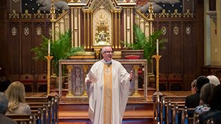 Rev. Msgr. Reilly preaches at Mass in the Chapel